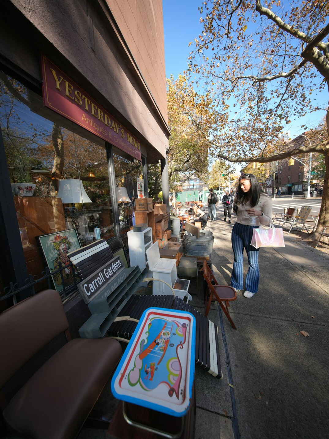 Shoppers queuing outside a furniture store during a sale